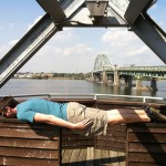 person planking (laying flat and rigid across surfaces)