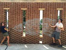 Spraying a friend with a water hose