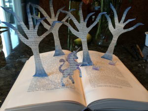 open book with tree and unicorn popup cutouts